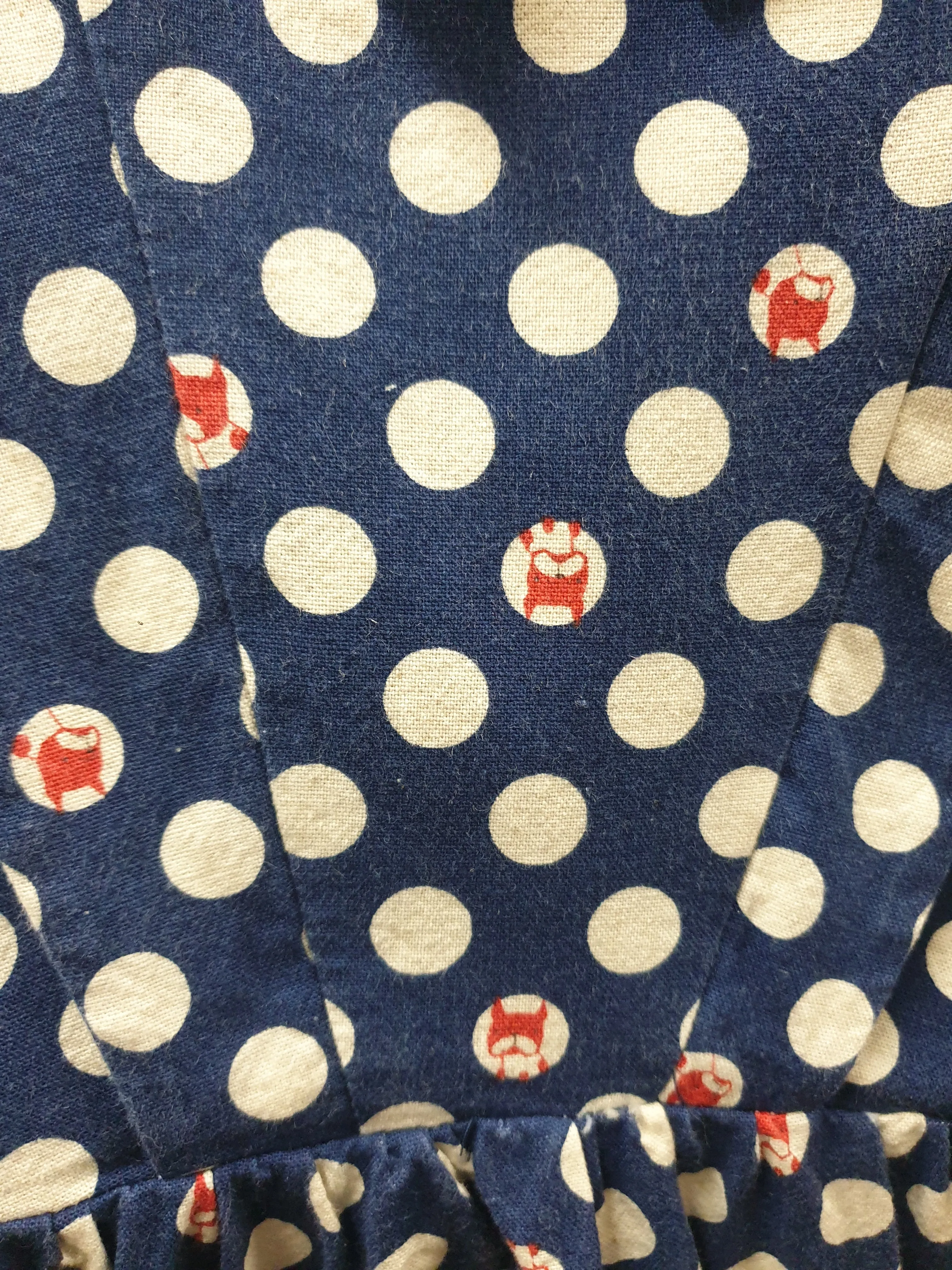 Made590 sleeveless blue and white polka dot dress with dog faces size M (best fits 10)